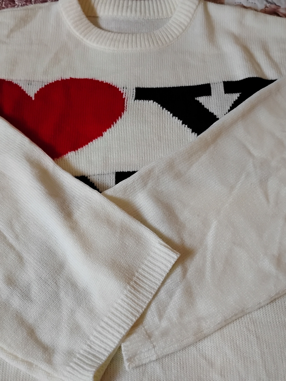 a new day White Sweater with Red Heart and Black Graphic